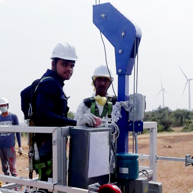 Wind turbine maintenance platform with wire rope hoist for safe tower service